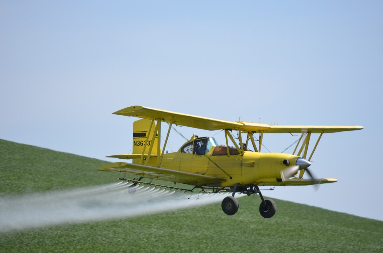 The Ag-Cat biplane making a pass